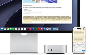 Mac mini de face, glissé sous un Studio Display, un iPhone se trouve à droite de l'appareil et de l'écran, du texte sélectionné avec les commandes Couper, Copier, Coller et Remplissage automatique en haut de l'iPhone correspond au texte surligné à l'écran, illustrant le fonctionnement du presse-papiers universel
