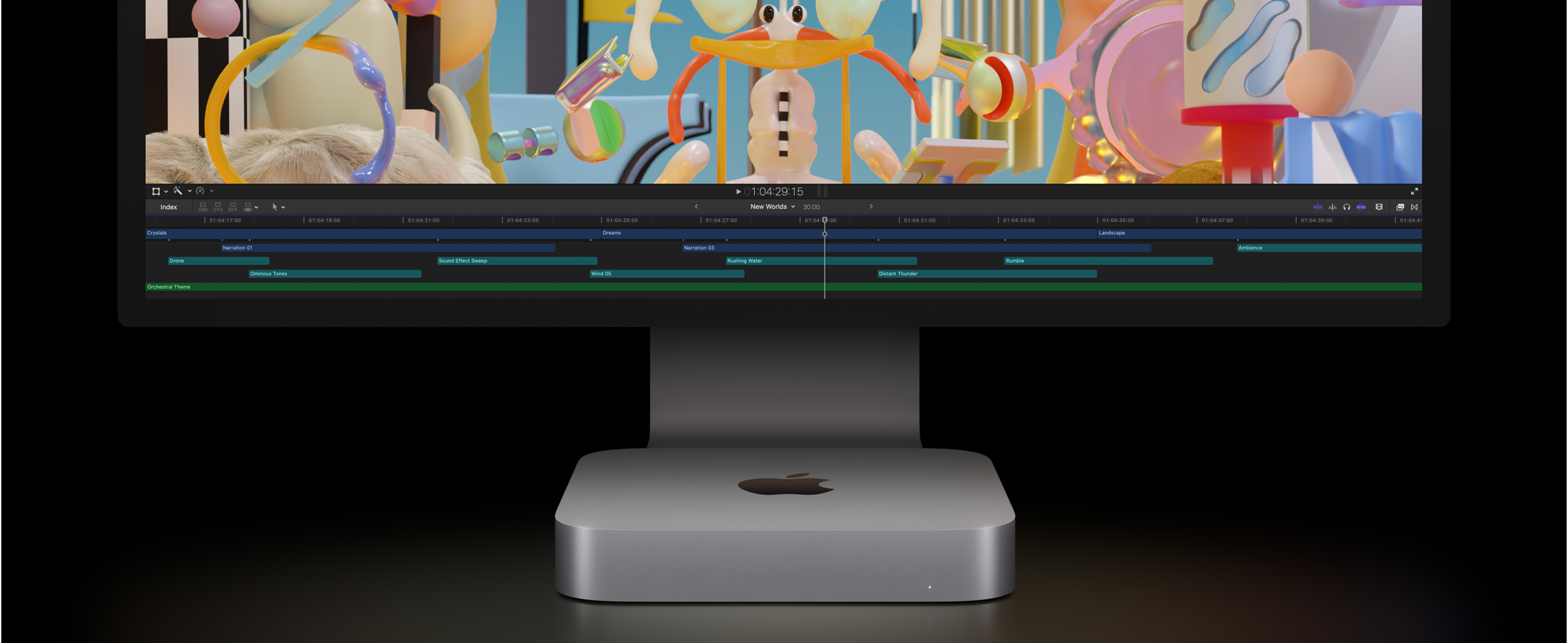 Vue de face d'un Mac mini et d'un Studio Display affichant un projet de montage vidéo dans Final Cut Pro.